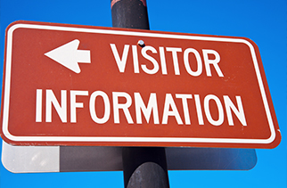 sign that says visitor information