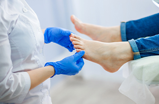doctor looking at a foot