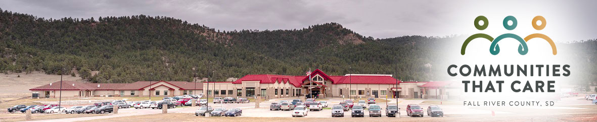 Banner picture of an outside view of the Hospital and hills behind it.