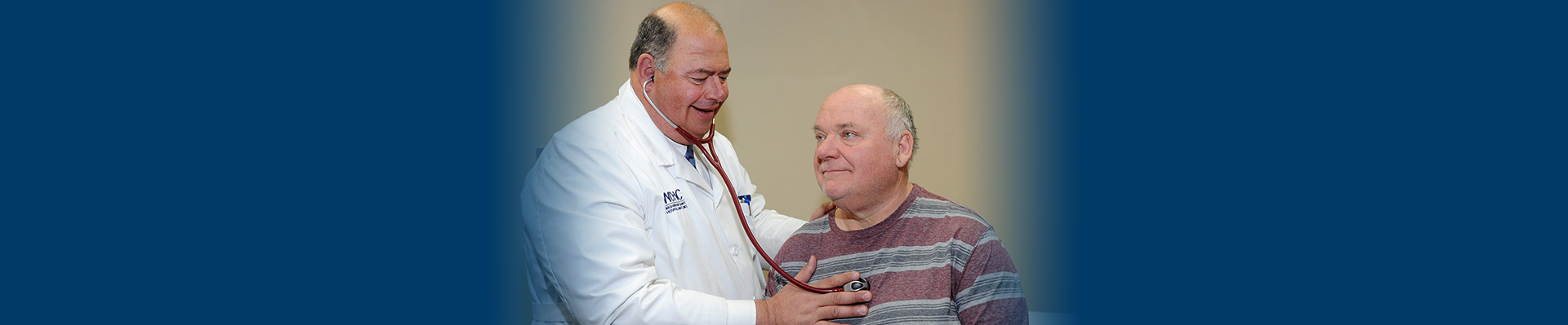 Banner picture of a male Physician using a stethoscope to check a male patient's heart.