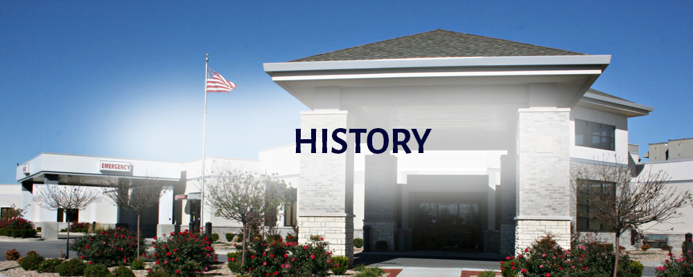 Banner picture of Wilson Medical Center with the United States flag blowing in the front of the Hospital. Banner says:
History
