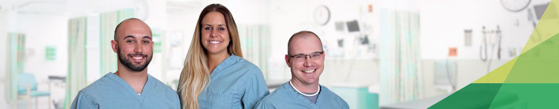 Picture of three smiling Nurses. There is two males and one female.