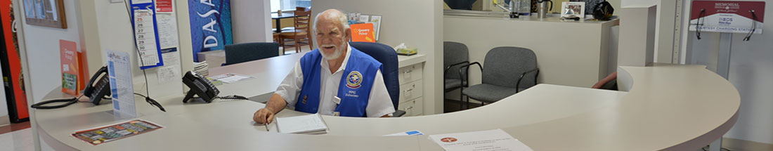 This is a picture of a volunteer sitting at a desk.