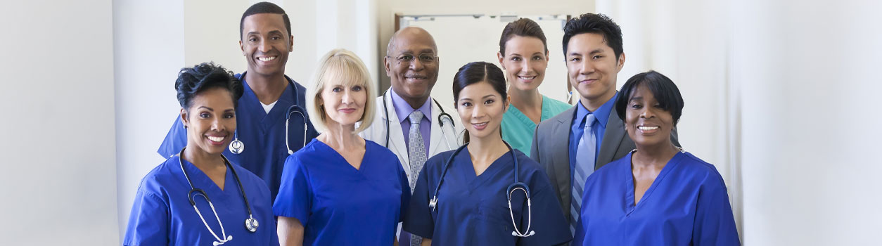 Banner picture of men and women Physicians and Nurses smiling.