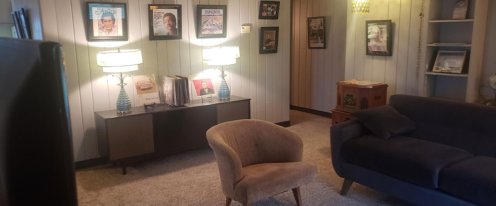 A room inside of Muscle Shoals Music Cottage filled with artist memorabilia
