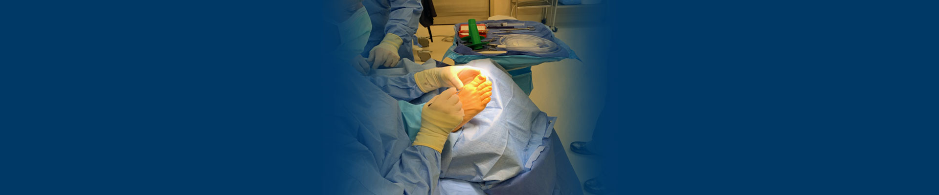 Banner picture if a Medical Surgeon about to do surgery on a patient's foot.