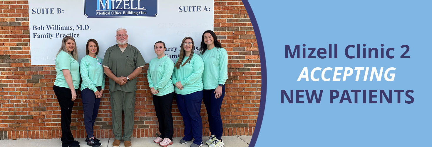 Banner picture of Clinic 2 Staff smiling. There is four females and one male smiling. Banner says:

Mizell Clinic 2 
ACCEPTING NEW PATIENTS