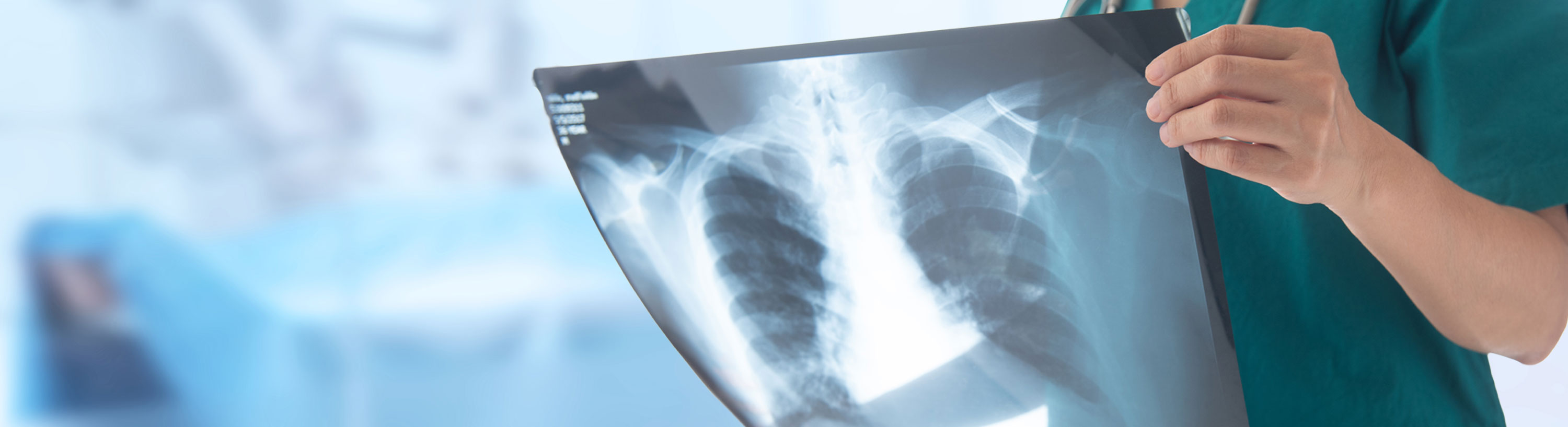 Banner Picture of a Nurse holding up a Radiology X-Ray Image.