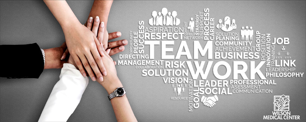 Banner picture of four hands on top of one another with words that describe "TEAM WORK."