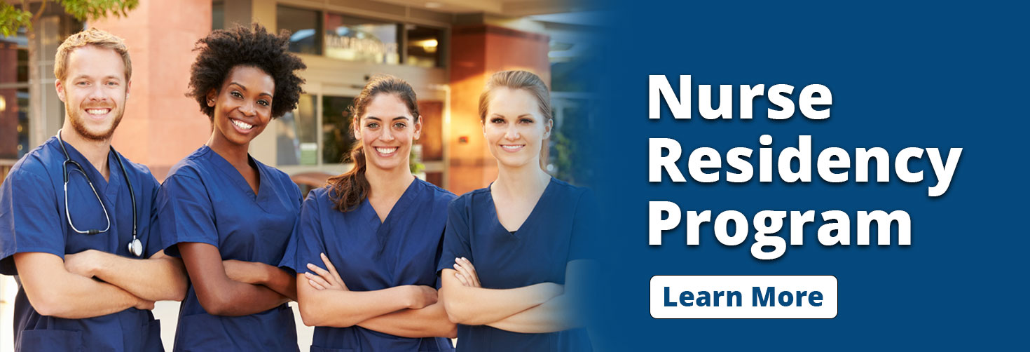 Banner picture of Four Nurses (one male and three females)standing outside in front of Main Hosptial Entrance doors. They are all smiling and folding their arms. Banner says:

Nurse Residency Program