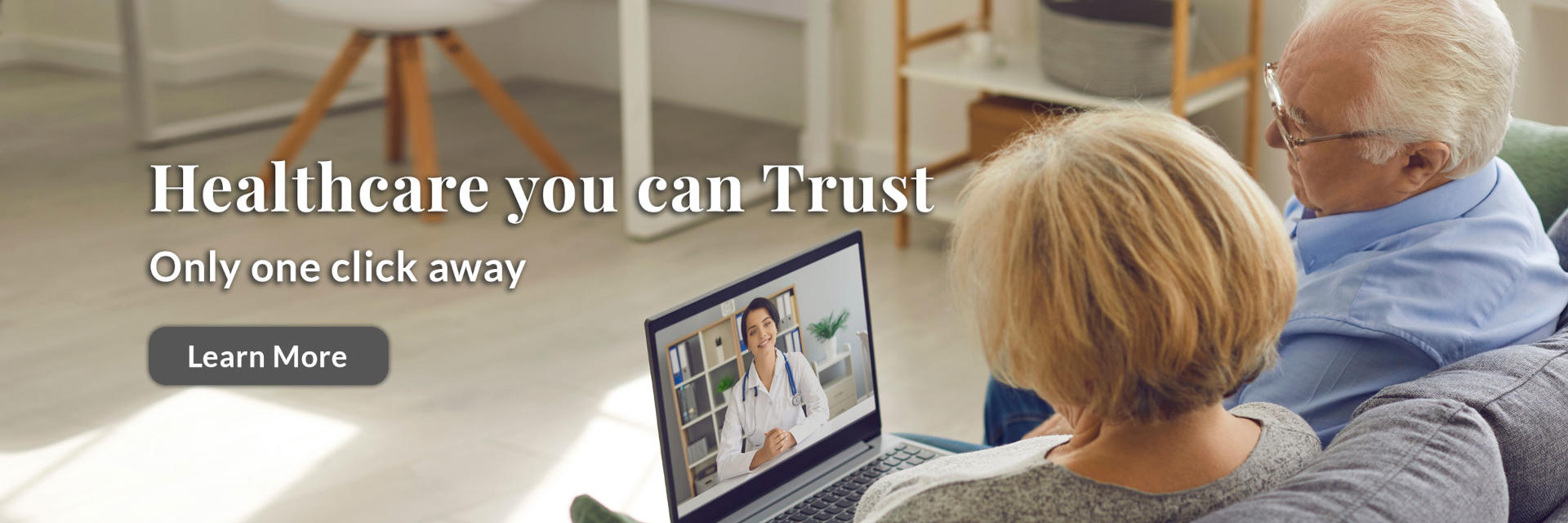 Banner picture of an elderly couple sitting down on a coach with an open laptop and on a video call with a female Physician.