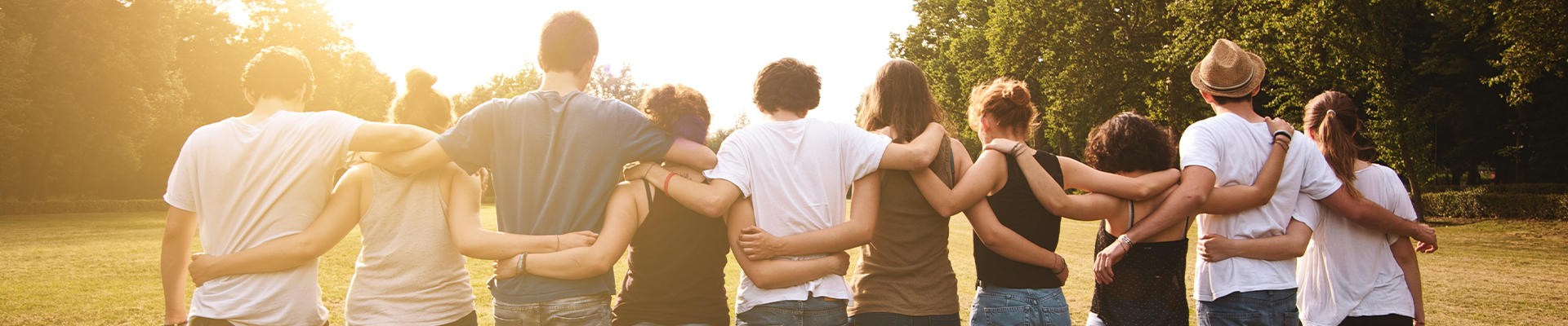 group of friends holding each other