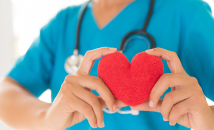 Nurse holding a soft plushy heart