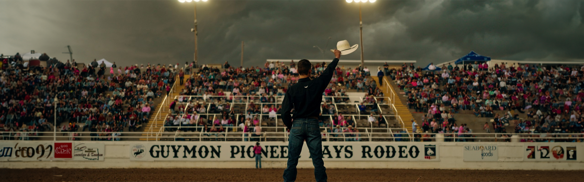 Kale Roark waving his hat to the crowd at the 2024 Guymon Pioneer Days Rodeo