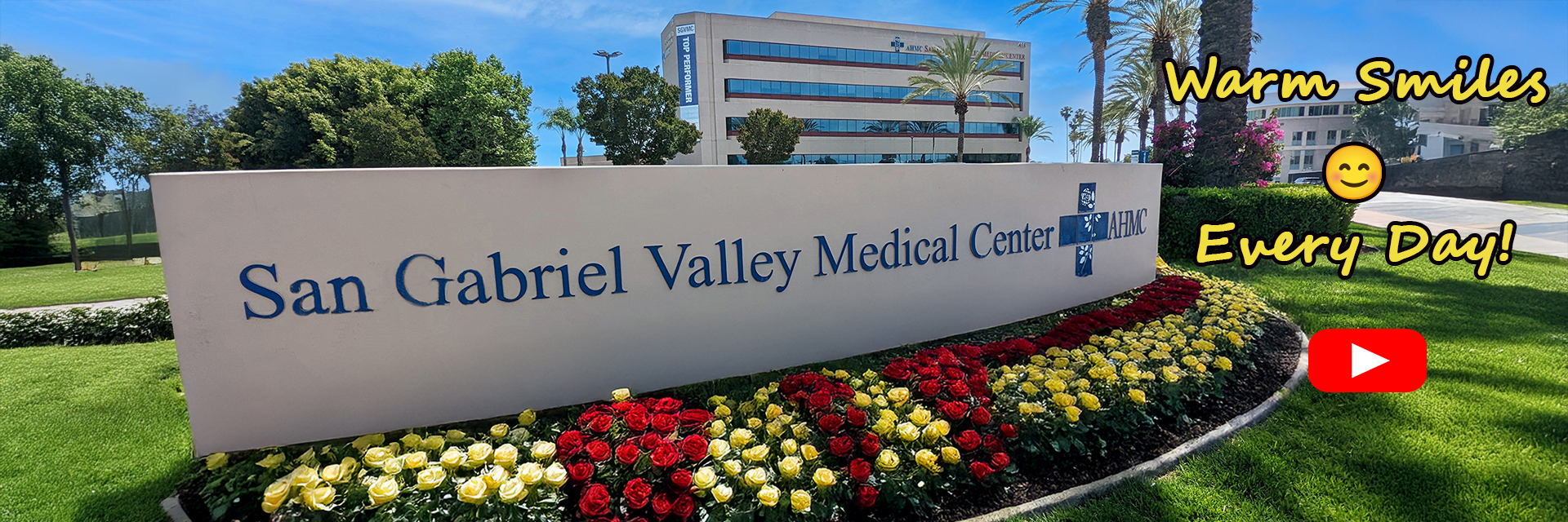 Photo of Hospital Sign with hospital in back