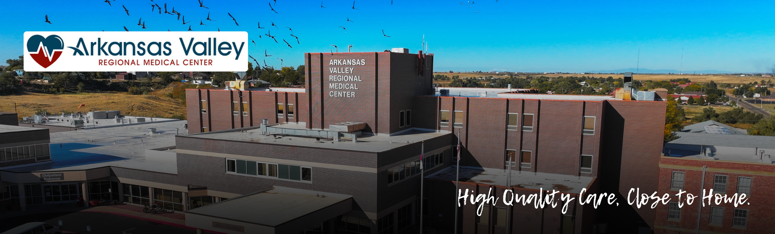 Aerial view of Arkansas Valley Regional Medical Center with logo and tagline: High-Quality Care. Close to home.