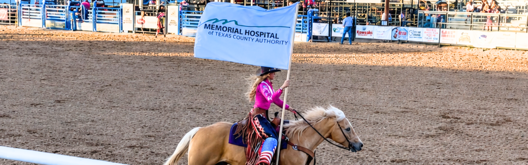 Rodeo Queen carrying MHTCA flag at the Guymon Pioneer Days Rodeo