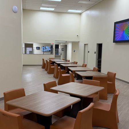 .therapy room with tables and chairs