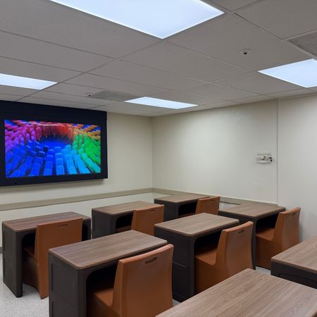 classroom with chairs and large screen
