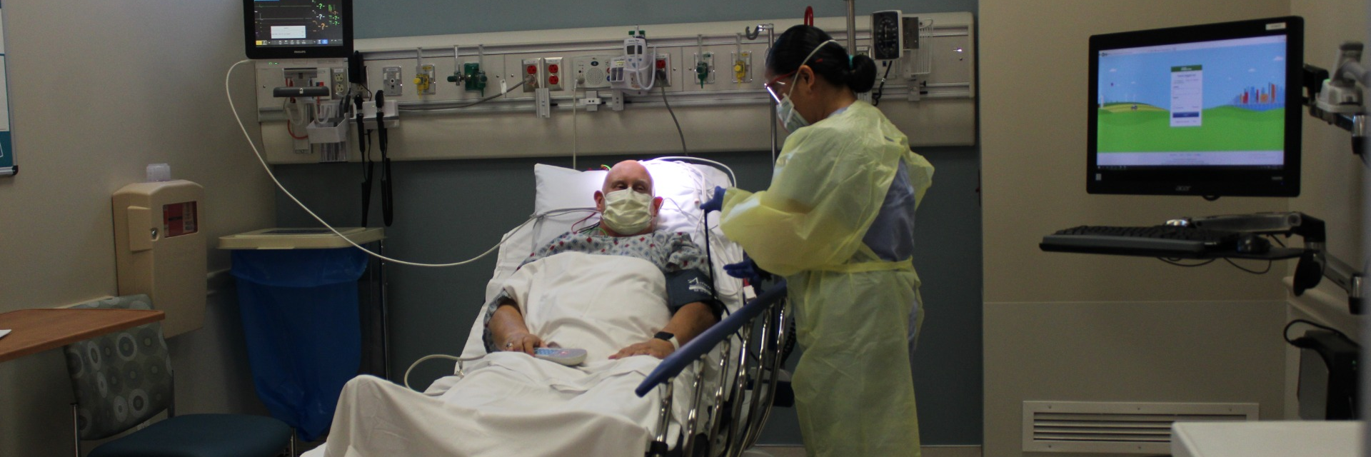 A caregiver attending to a patient at Parkview Community Hospital Medical Center.